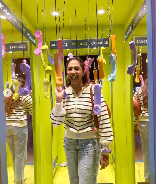 Abida in a colourful telephone installation